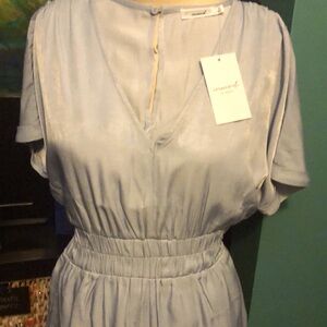 Lt Blue dressy short jumper, romper. NWT.Dolman sleeves, elastic waist, pockets